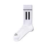 White WhiteSpace sock with logo on the side.