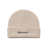 Beige beanie with 'Whitespace' logo on a white background