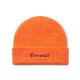 Orange beanie with 'WHITESPACE' logo on a white background