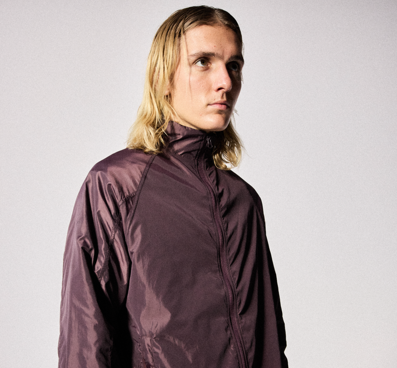 Male model wearing the WHITESPACE Windbreaker Jacket - Fudge.