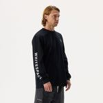 Model wearing Whitespace Block Long Sleeved tee in black and black pants on a white background.