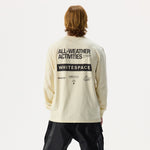 Model, shown from the back, wearing Whitespace Sports Long Sleeved Tee in bone and black pants on a white background.