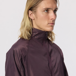 Model wearing the WHITESPACE Windbreaker Jacket in the color fudge.