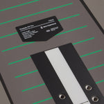 Grey Freestyle SW Pro snowboard deck with a label on a grey background