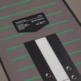 Grey Freestyle SW Pro snowboard deck with a label on a grey background