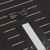 Black Freestyle SW Pro snowboard deck with a label on a black background