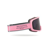 Dark tinted goggles in Pink Icing colorway with 'Whitespace' branding from a side view on a white background.