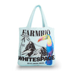 Light blue Farm Rio/WHITESPACE tote bag with toucan and mountain design on a white background