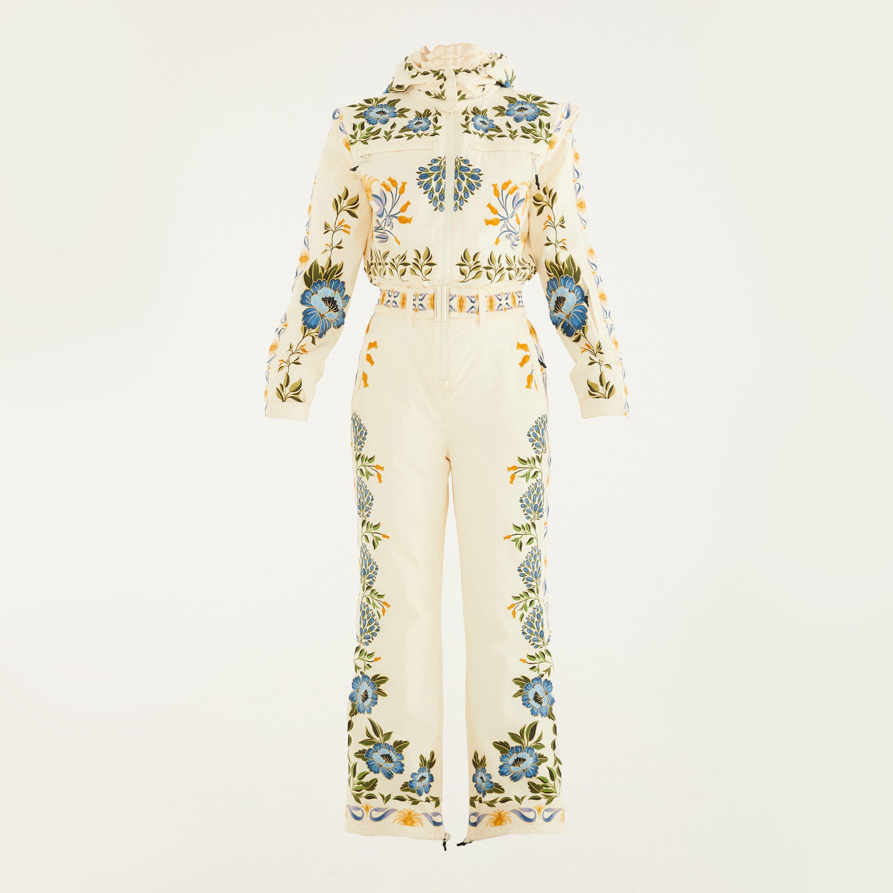 Flat lay of Farm Rio Winter Garden jumpsuit, a cream jumpsuit with green and yellow floral designs, on a white background.