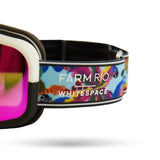 Ski goggles with colorful strap featuring 'Farm Rio/WHITESPACE' branding on a white background