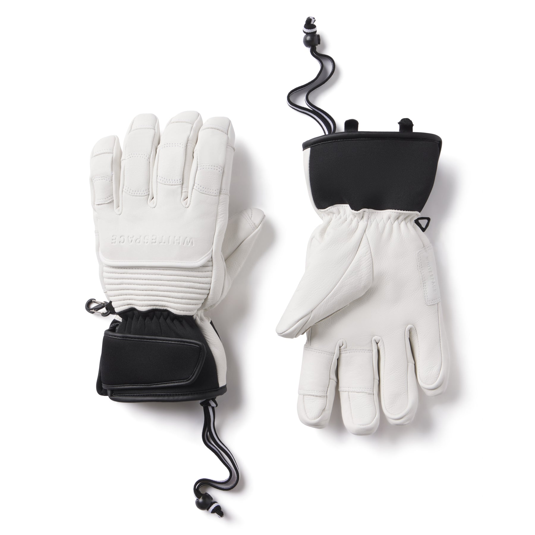 White gloves with black accents on a white background.  Brand logo across back of hand.