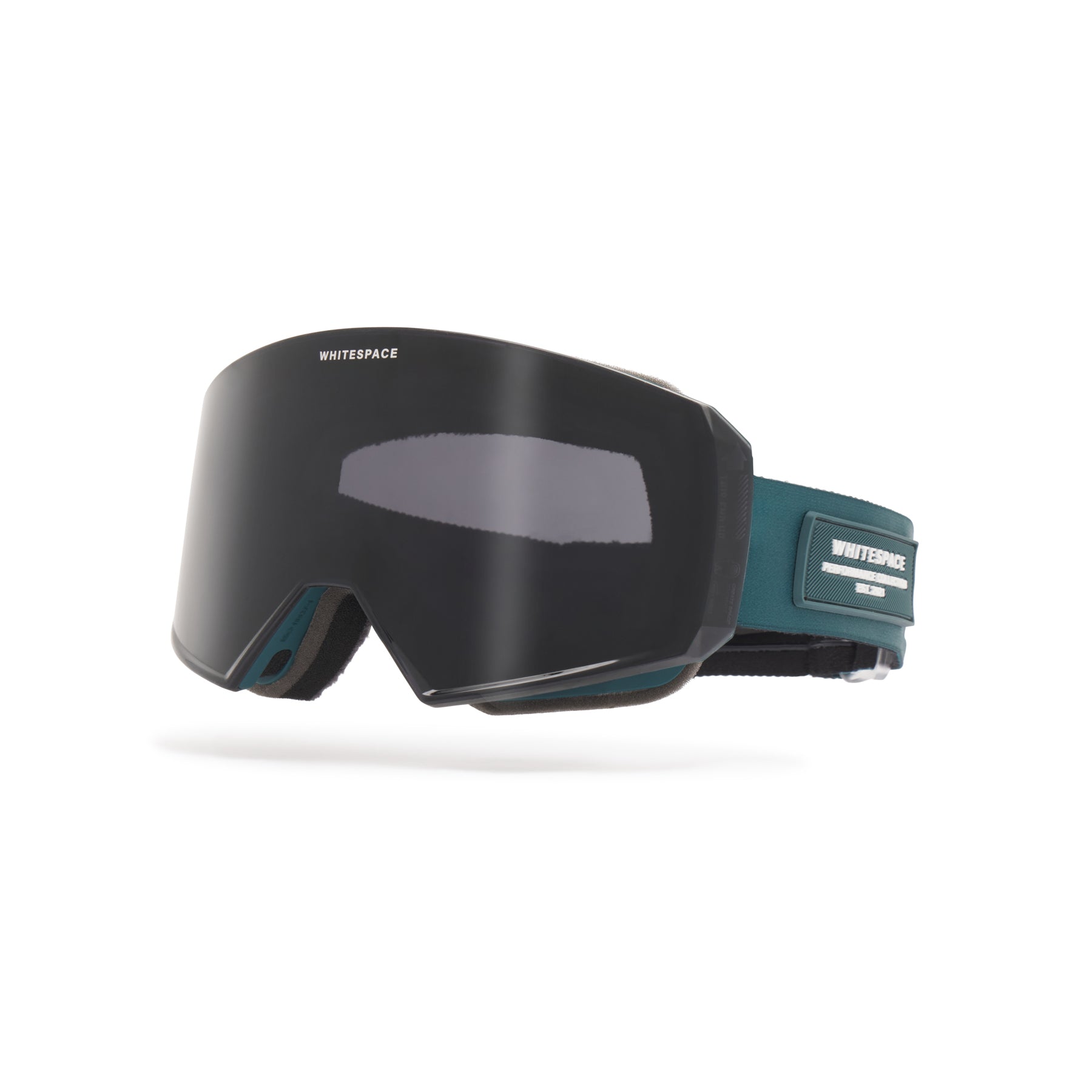 Dark tinted ski goggles with deep blue strap featuring 'Whitespace' branding on a white background.