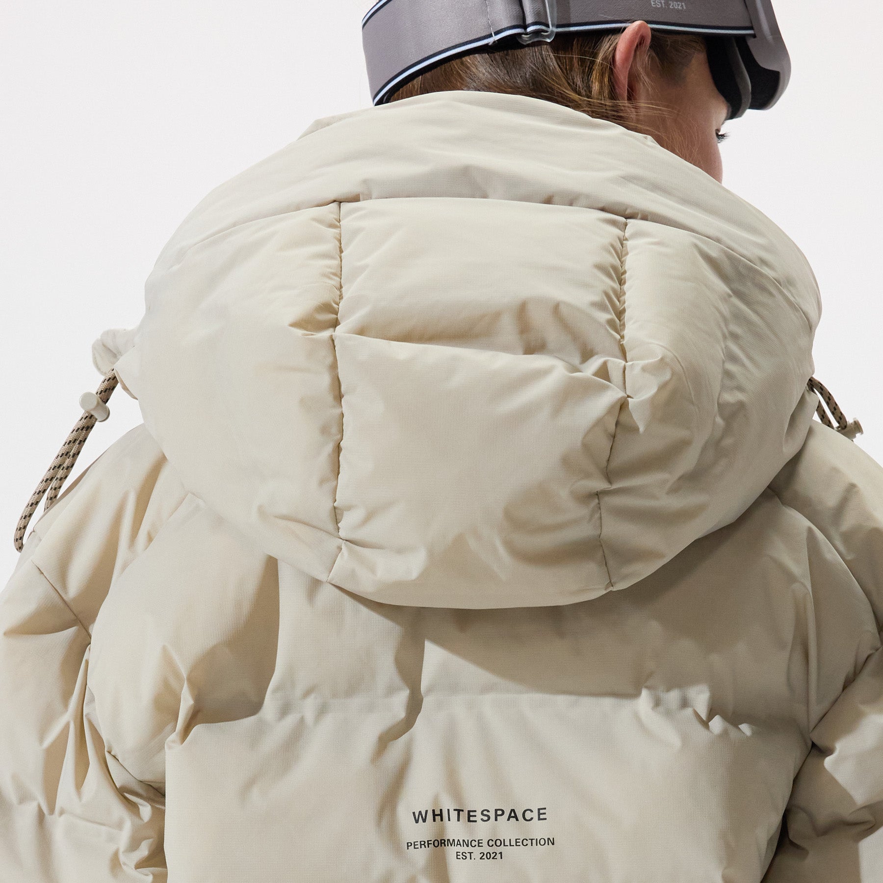 Model wearing a Insulated Parka Jacket in Plaza Taupe, shown from the back, on a white background.