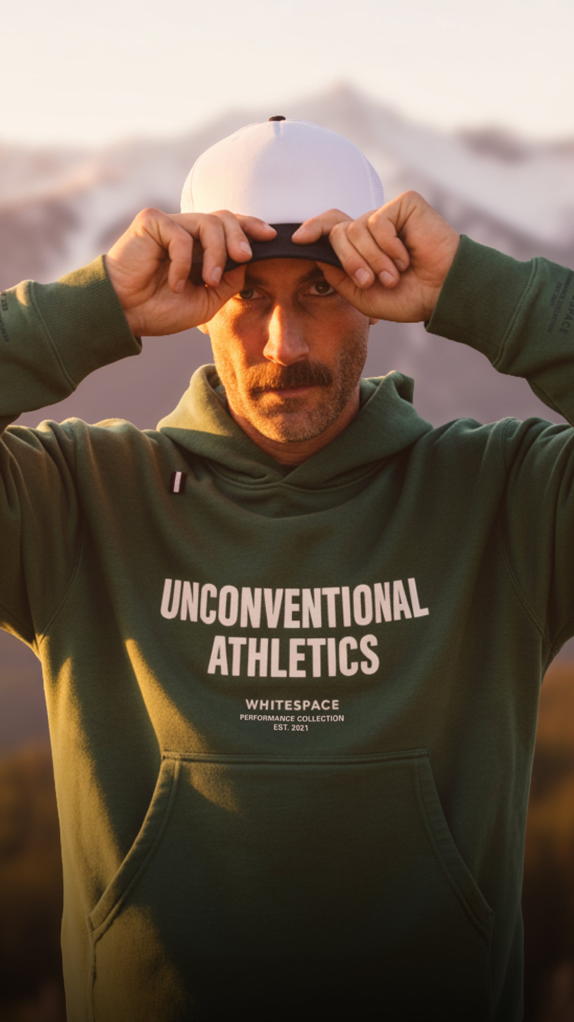 Model wearing WHITESPACE  Unconventional Athletics Hoodie in Rainforest.