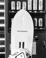 Vending machine with Kirin drinks witha  WHITESPACE snowboard in front