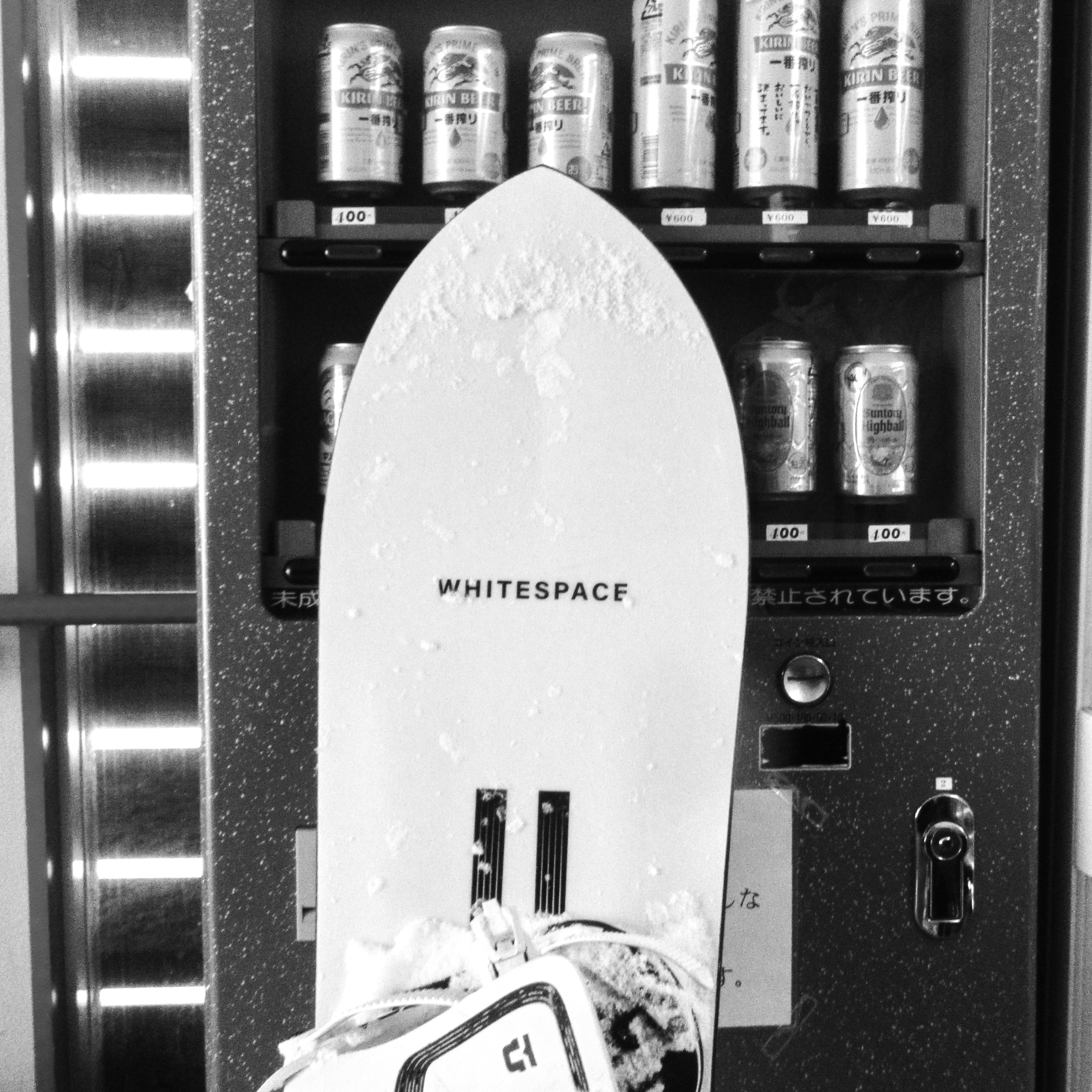 Vending machine with Kirin drinks witha  WHITESPACE snowboard in front