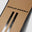 Close up of Moncler Grenoble x WHITESPACE Snowboard in Light Brown showing the name and binding insert pattern.