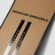 Close up of Moncler Grenoble x WHITESPACE Snowboard in Light Brown showing the name and binding insert pattern.