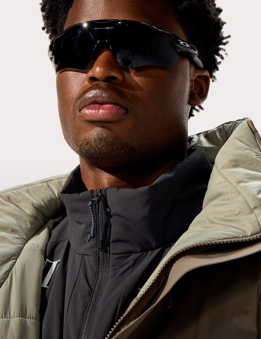 Model wearing the WHITESPACE Parka and Insulated Cargo Midlayer Jacket.