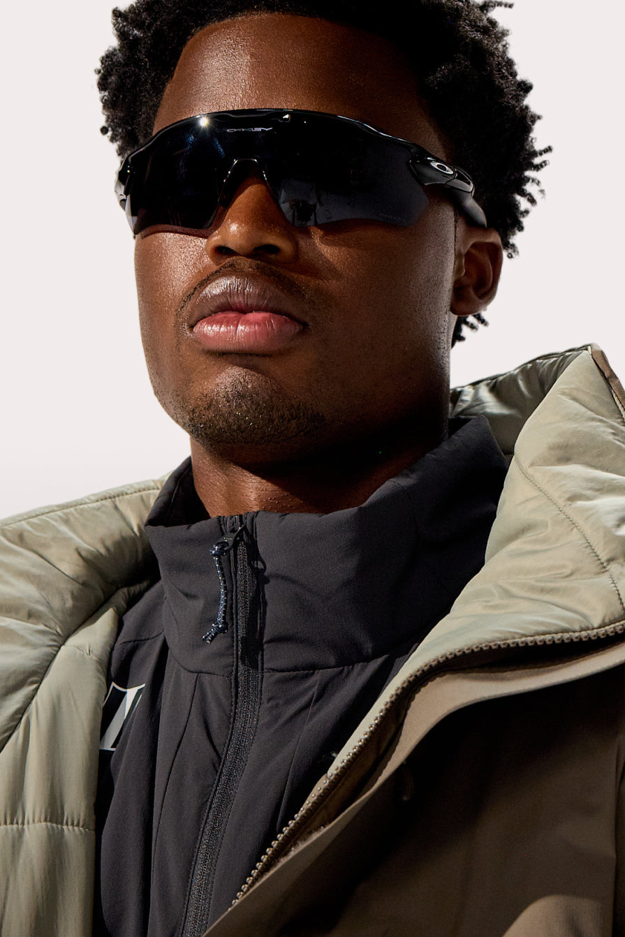Model wearing the WHITESPACE Parka and Insulated Cargo Midlayer Jacket.