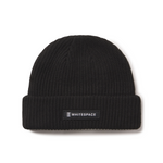 Black beanie with a 'Whitespace' label on a white background