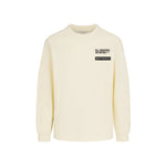 Beige long-sleeved tee shirt with WHITESPACE logo on the chest against a white background