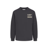 Black  long-sleeved tee shirt with WHITESPACE logo on the chest against a white background