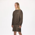 Model wearing WHITESPACE Fleece Crewneck in slate black and slate black fleece shorts, shown from the knees up, against a white background.
