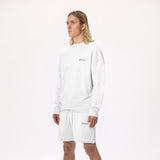 Model wearing WHITESPACE Fleece Crewneck in whisper white and whisper white fleece shorts, shown from the knees up, against a white background.