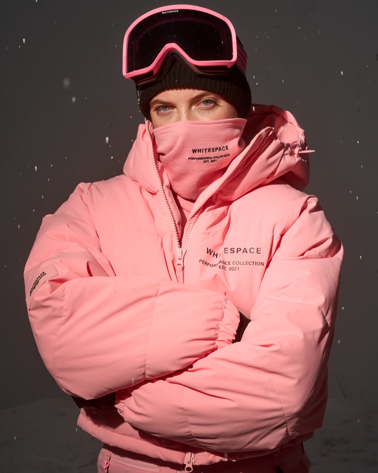 Model wearing the WHITESPACE Cropped Puffer Jacket and Bib Pant in Pink Icing.