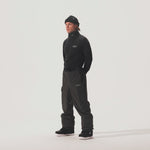 Video of model wearing AMF Riding Pant in Phantom colorway and coordinating black shirt and beanie.