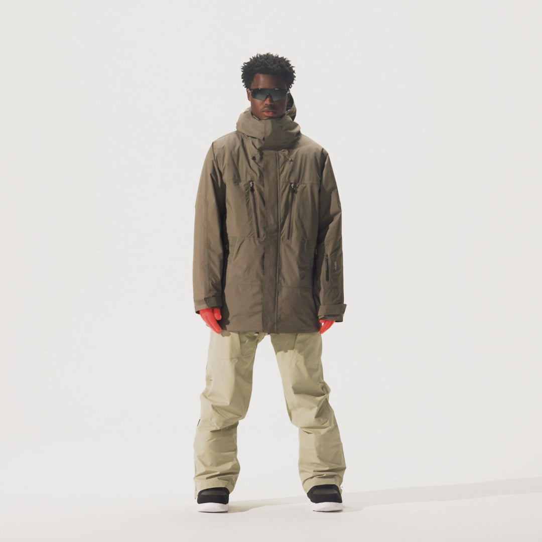 Video of model wearing beige pants and Whitespace Parka Jacket in Falcon colorway.