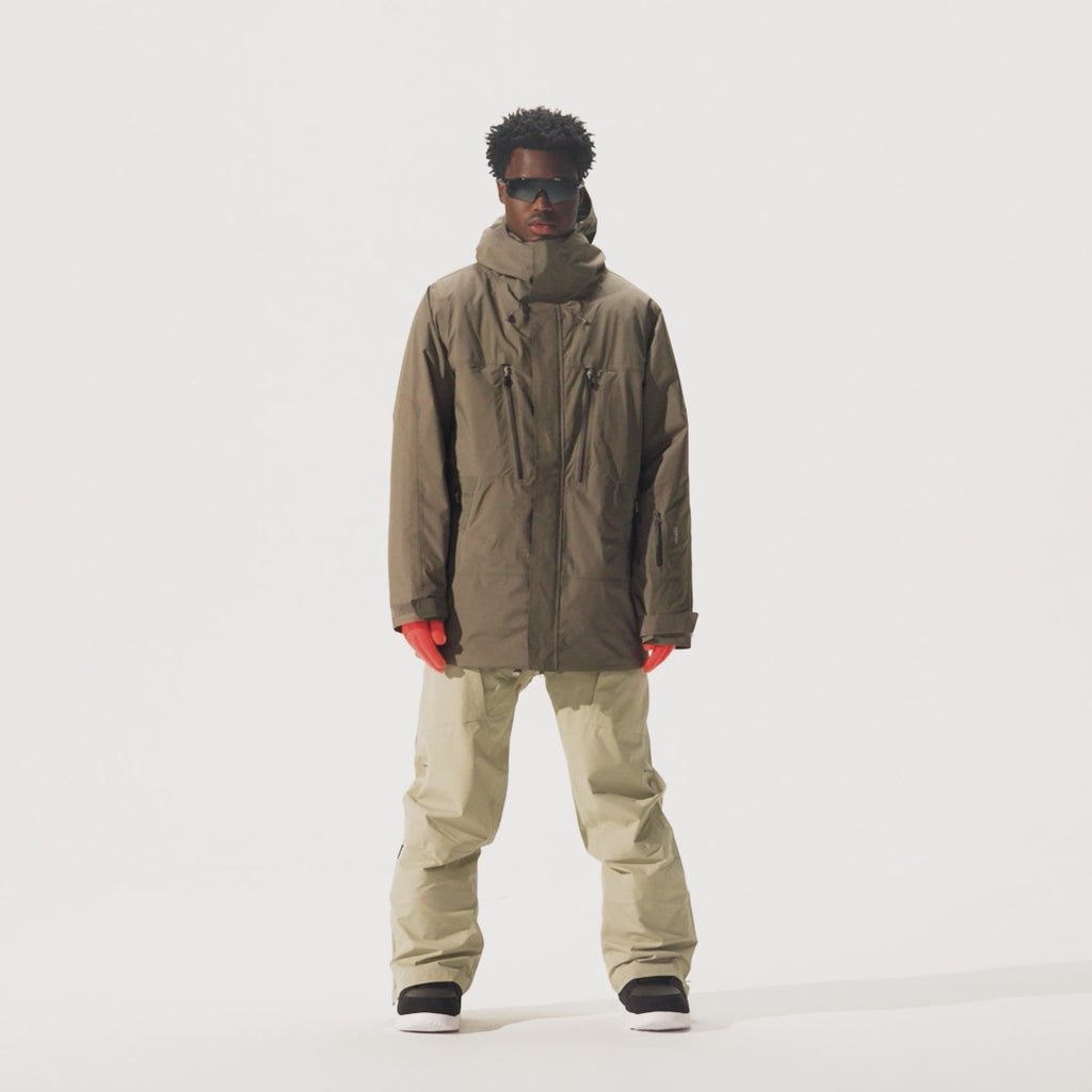 Video of model wearing beige pants and Whitespace Parka Jacket in Falcon colorway.
